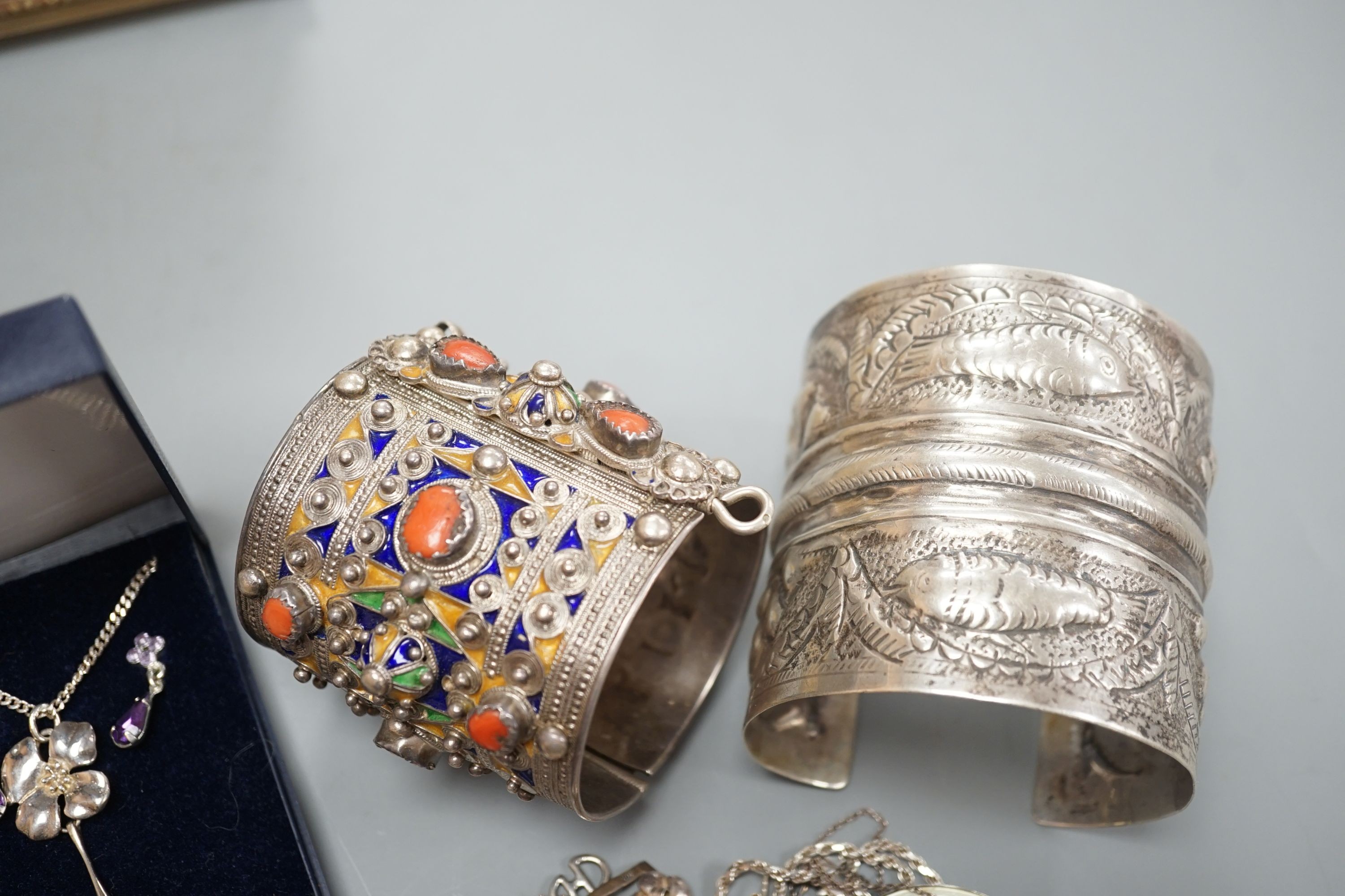 A 1950's box and a quantity of assorted costume jewellery, including continental bangles, etc.